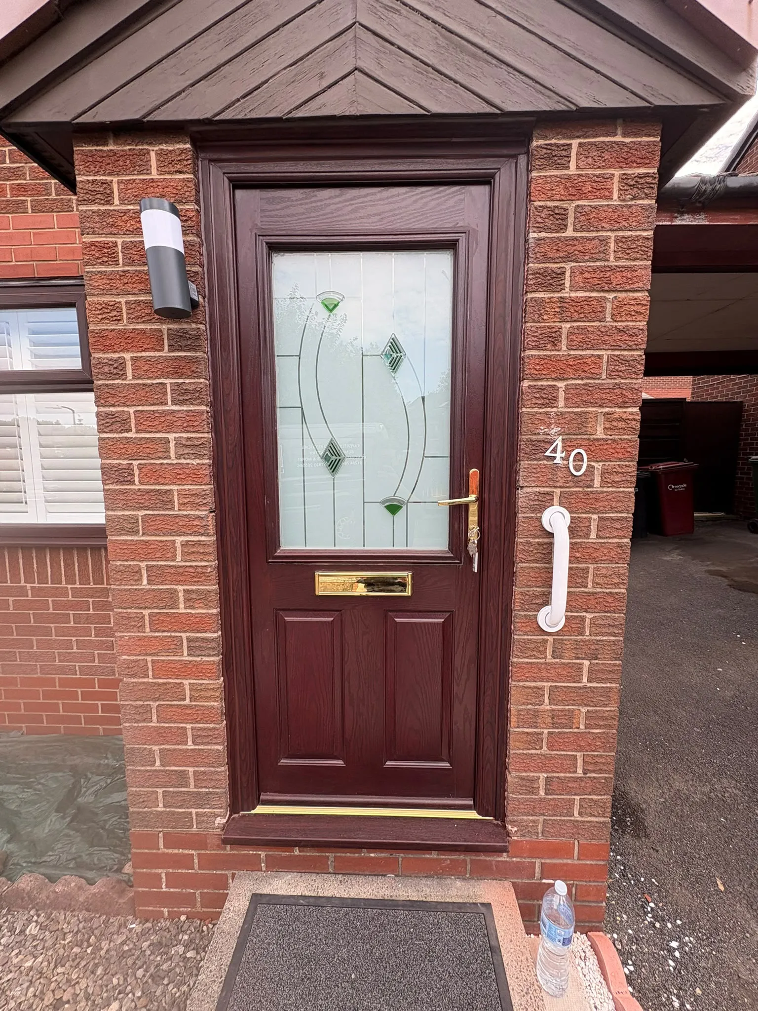 Maroon composite front door installed by LDG Joinery LTD, Bolton